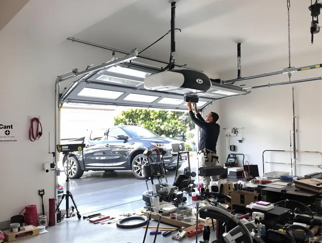 The Hammocks Garage Door Repair specialist installing smart garage door opener system in The Hammocks home