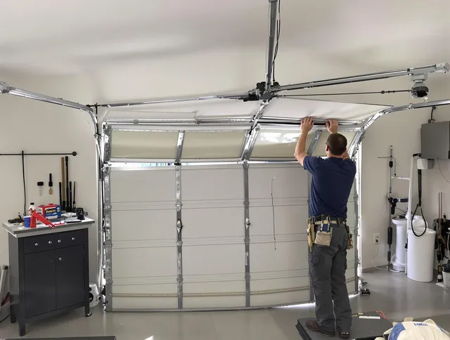 The Hammocks Garage Door Repair specialist performing precise section replacement on The Hammocks garage door