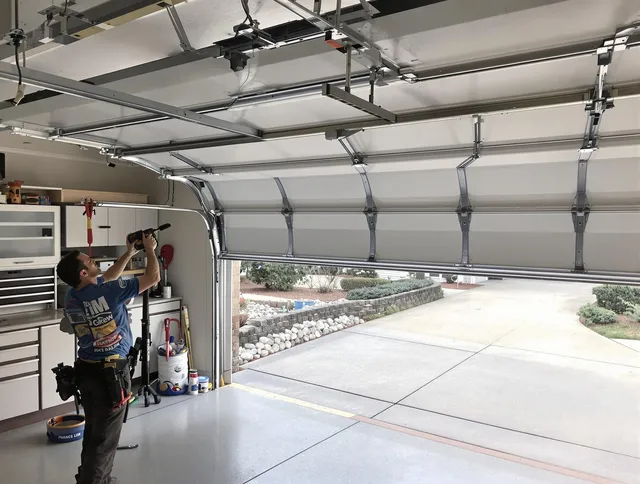 Garage door track repair service by The Hammocks Garage Door Repair in The Hammocks